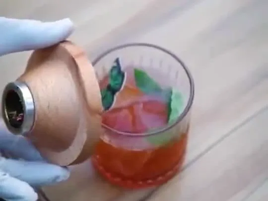 The Piano Project: hands preparing a drink behind a bar.